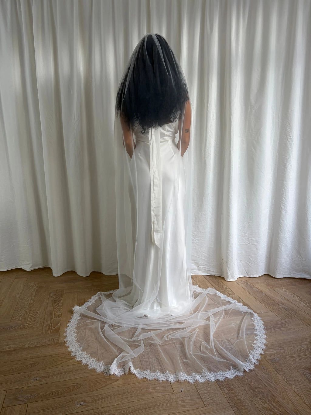 Single-tier vintage lace trim cathedral veil with a soft, cloak-like fall in lightweight tulle — romantic and ethereal bridal design.