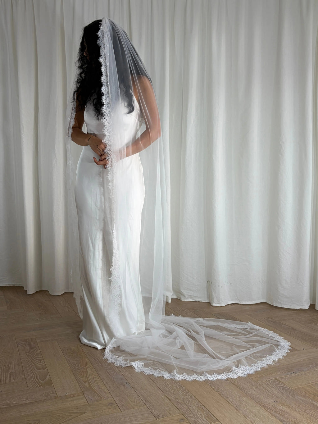 Single-tier vintage lace trim cathedral veil with a soft, cloak-like fall in lightweight tulle — romantic and ethereal bridal design.
